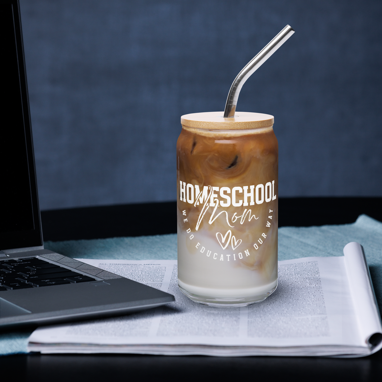 16 oz 'Homeschool Mom' glass jar with wooden lid and metal straw (on desk)
